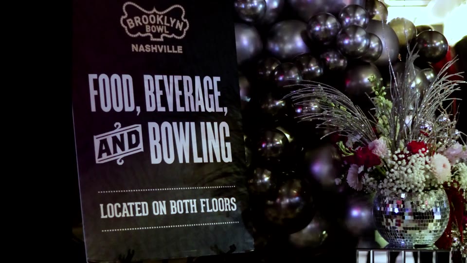 Brooklyn Bowl Nashville signage alongside holiday decorations in the event recap
